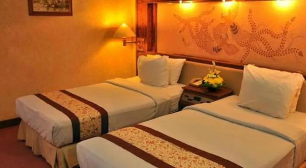 Bed in Kartika Chandra Hotel