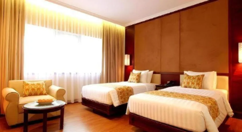 Bed in Kartika Chandra Hotel