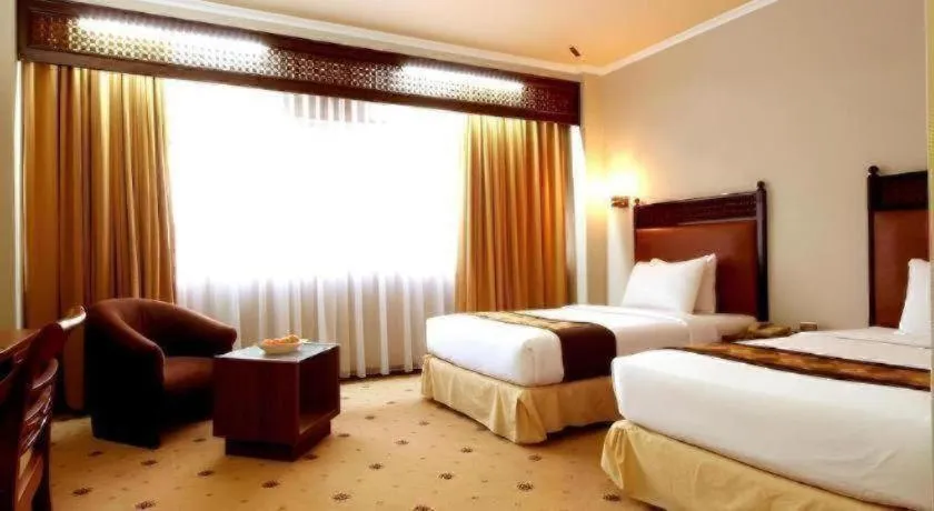 Bed in Kartika Chandra Hotel