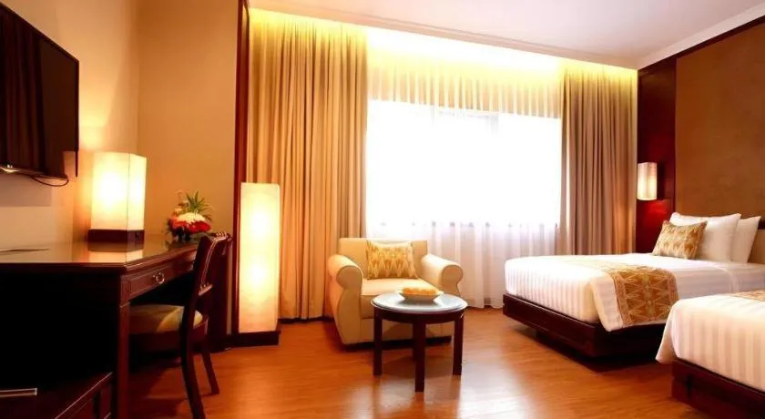 Bed in Kartika Chandra Hotel