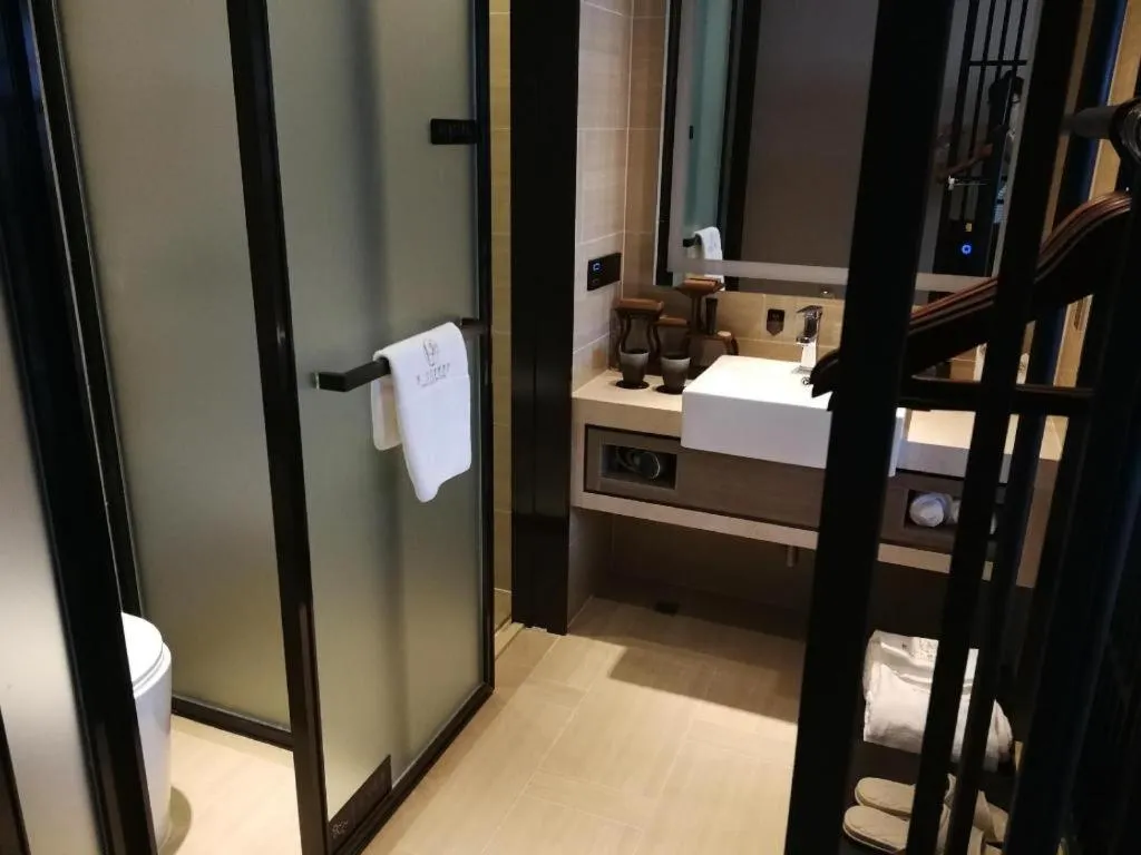 Bed in Yuan Culture Hotel Shenzhen World Shajing