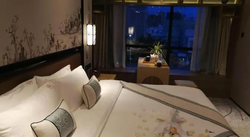 Bed in Yuan Culture Hotel Shenzhen World Shajing
