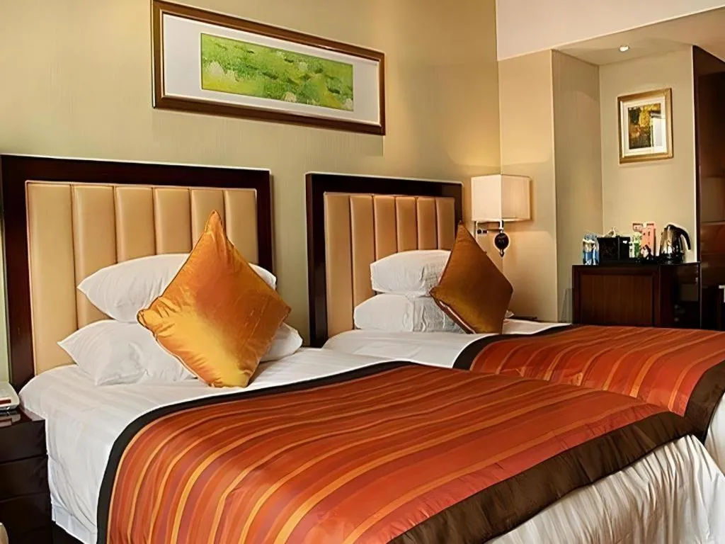 Bed in New Century Shaoxing Grand Hotel