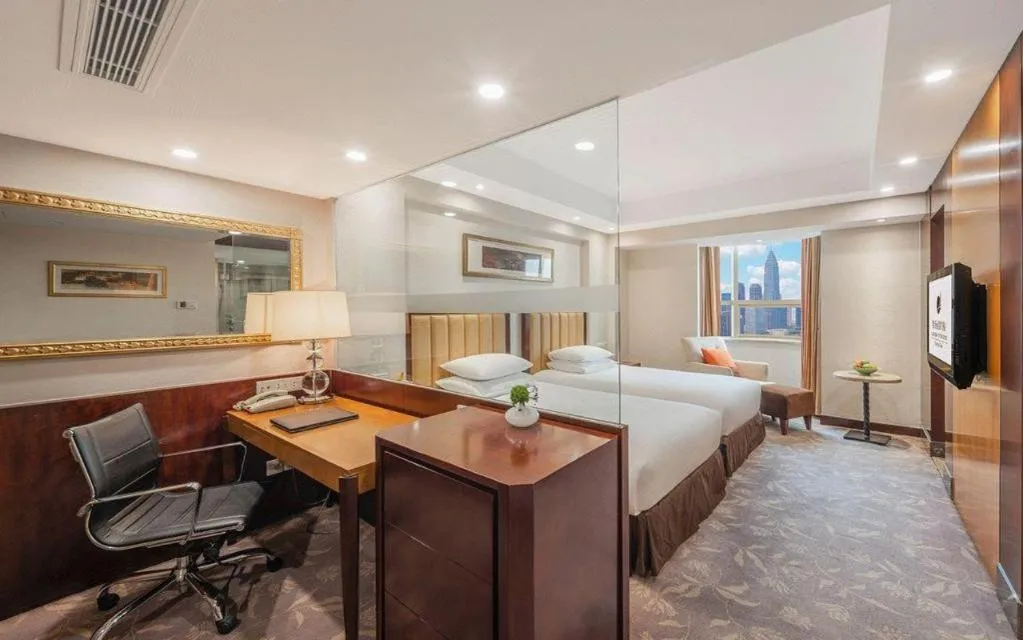 Bed in New Century Shaoxing Grand Hotel