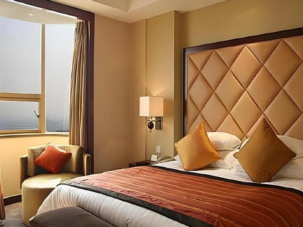 Bed in New Century Shaoxing Grand Hotel