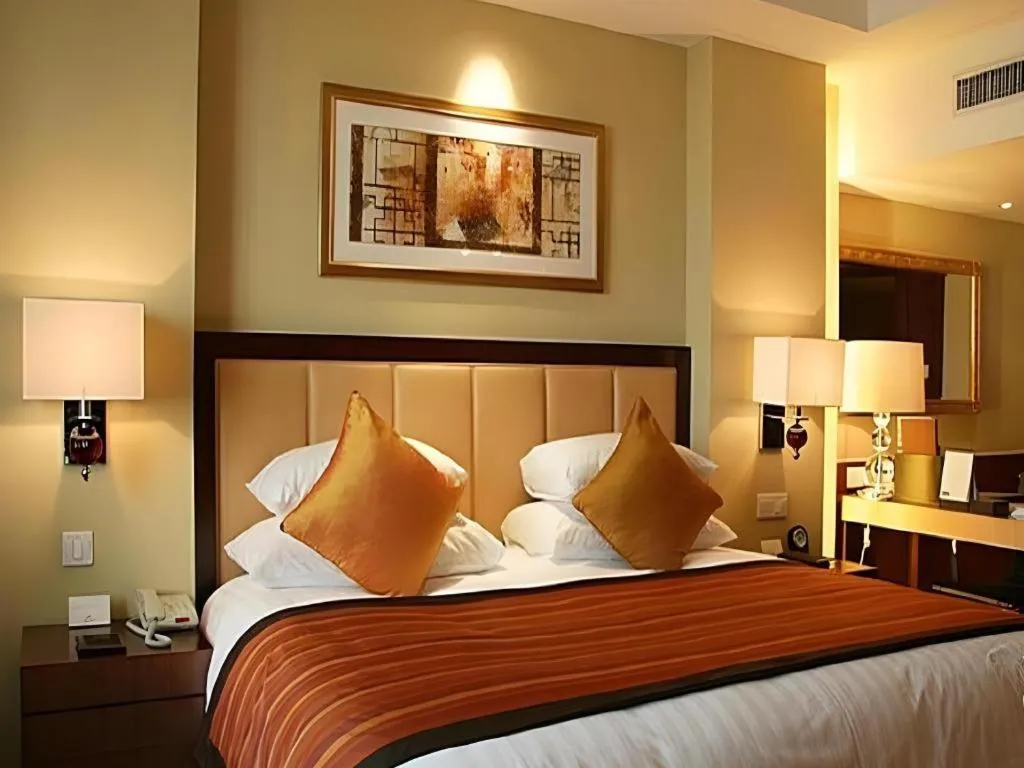 Bed in New Century Shaoxing Grand Hotel