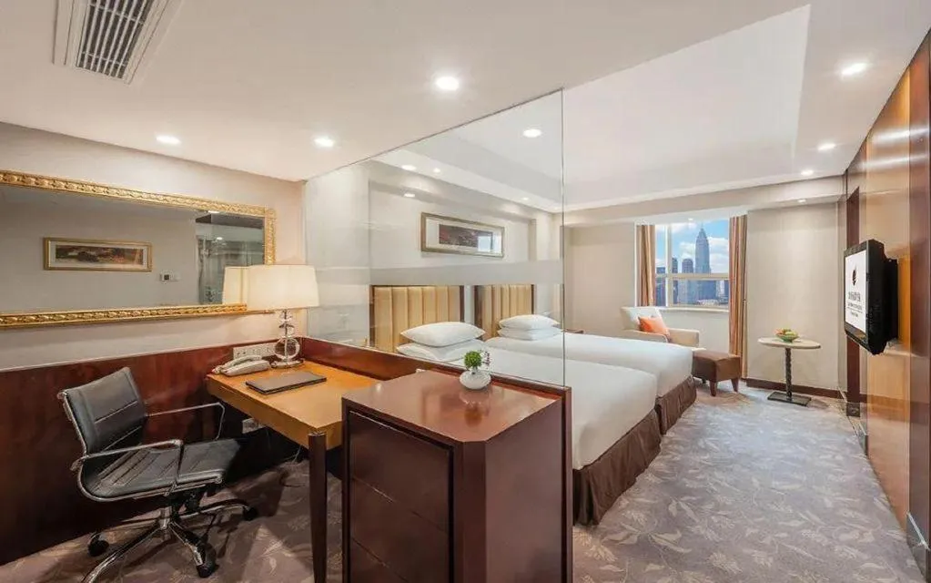 Bed in New Century Shaoxing Grand Hotel