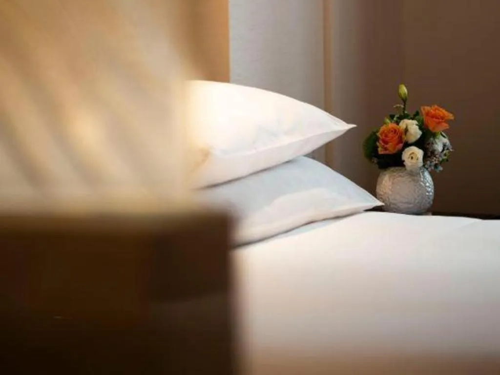 Bed in New Century Shaoxing Grand Hotel