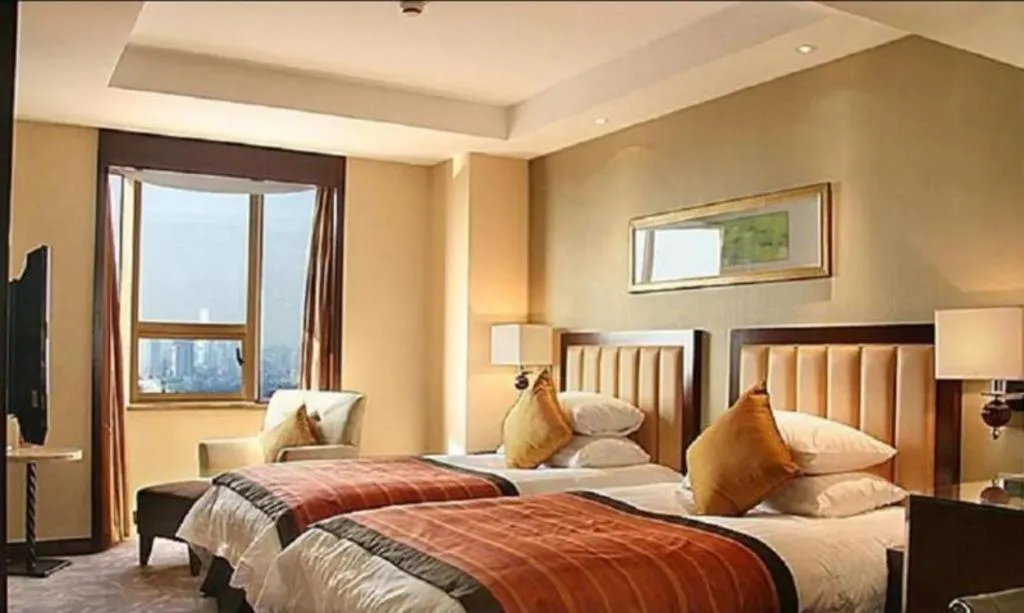 Bed in New Century Shaoxing Grand Hotel