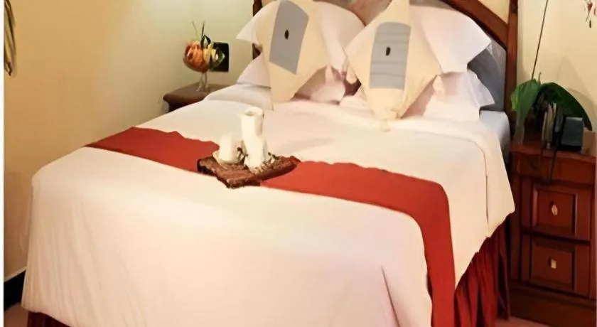 Bed in Sahid Kawanua Hotel