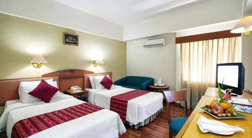 Bed in Sahid Kawanua Hotel