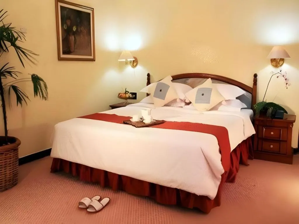 Bed in Sahid Kawanua Hotel