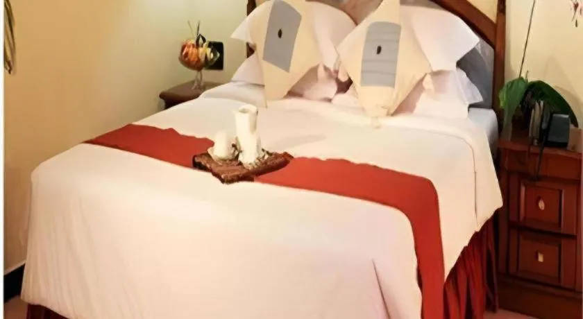 Bed in Sahid Kawanua Hotel