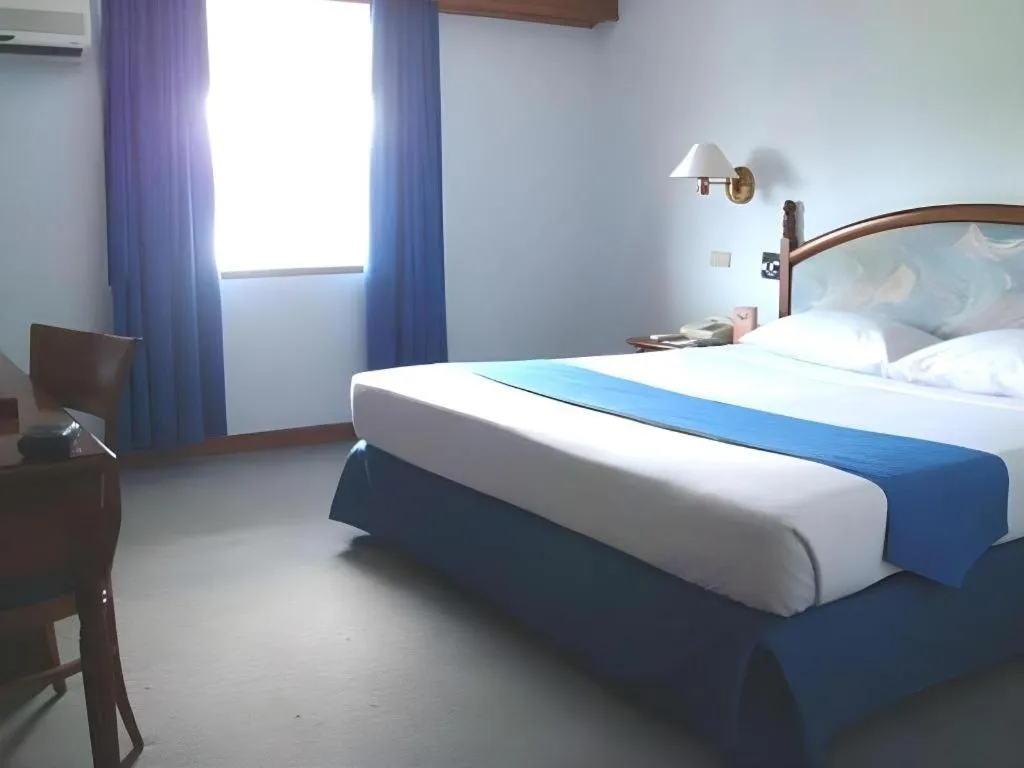 Bed in Sahid Kawanua Hotel