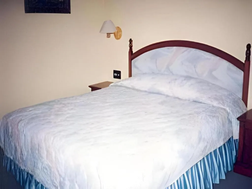 Bed in Sahid Kawanua Hotel