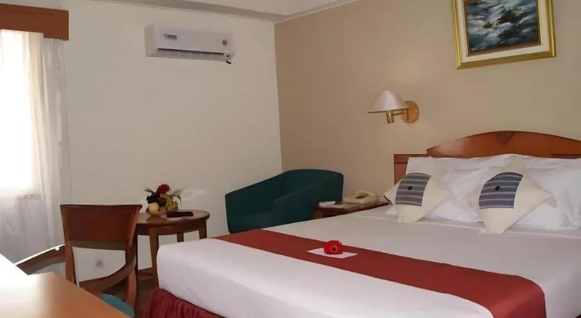 Bed in Sahid Kawanua Hotel