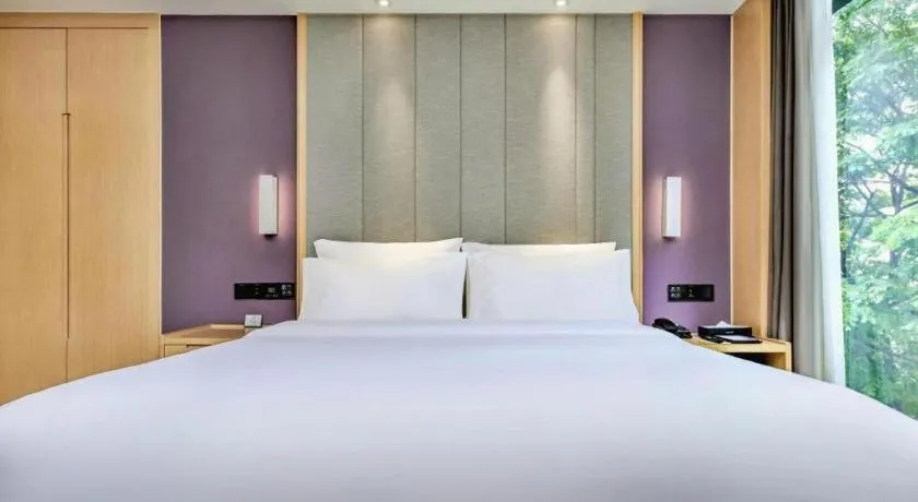 Bed in Lavande Hotel·Xishuangbanna Jinghong Songkran Square