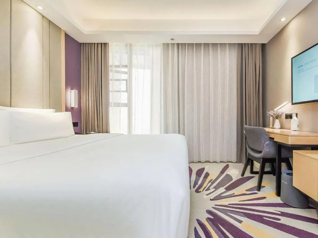 Bed in Lavande Hotel·Xishuangbanna Jinghong Songkran Square