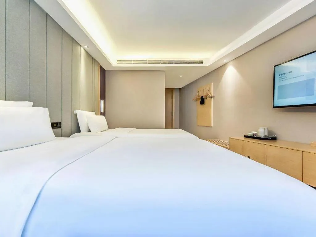 Bed in Lavande Hotel·Xishuangbanna Jinghong Songkran Square