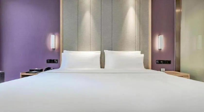 Bed in Lavande Hotel·Xishuangbanna Jinghong Songkran Square