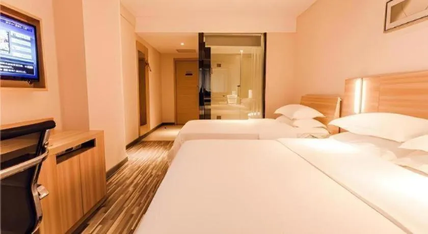 Bed in City Comfort Inn Chibi Railway Station