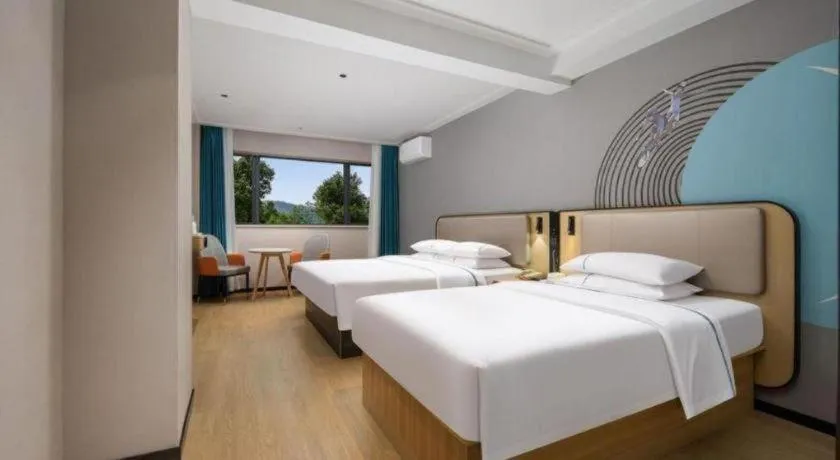 Bed in City Comfort Inn Chibi Railway Station