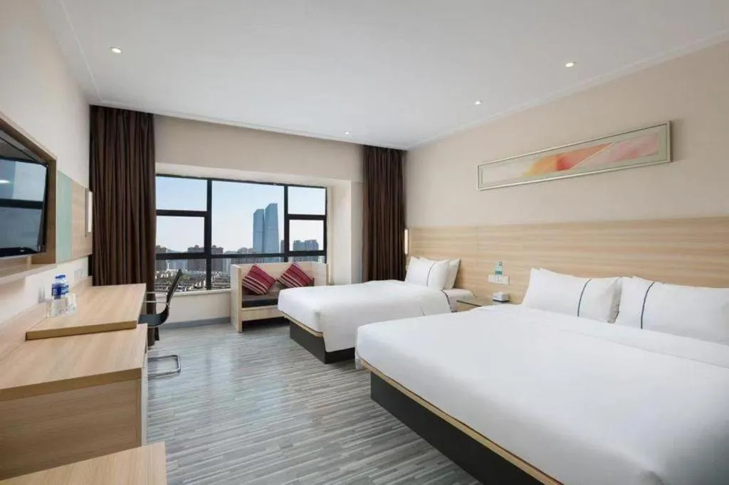 Bed in City Comfort Inn Zhongshan Shaxi Starbao Rosewood Expo City