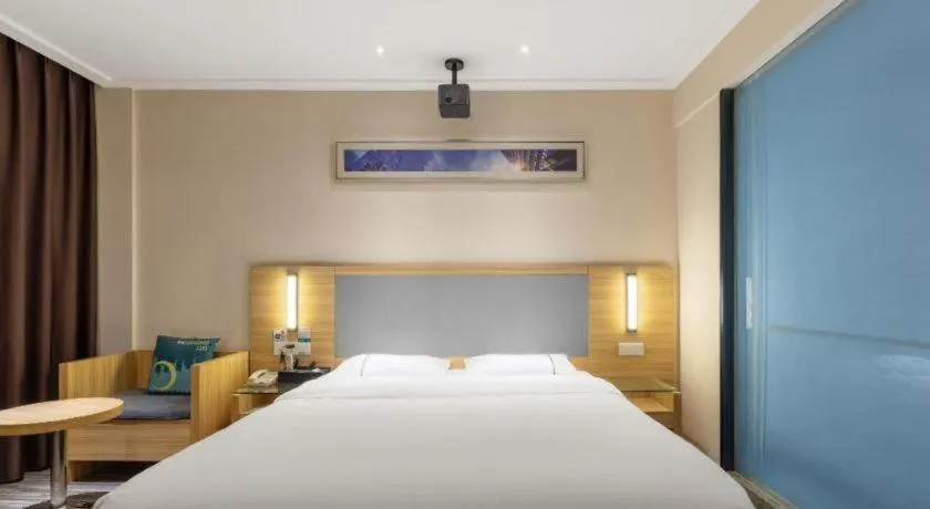 Bed in City Comfort Inn Zhongshan Shaxi Starbao Rosewood Expo City