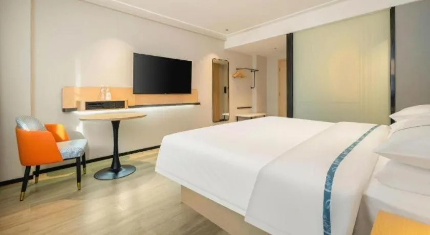 Bed in City Comfort Inn Wuzhou Wangcheng Square