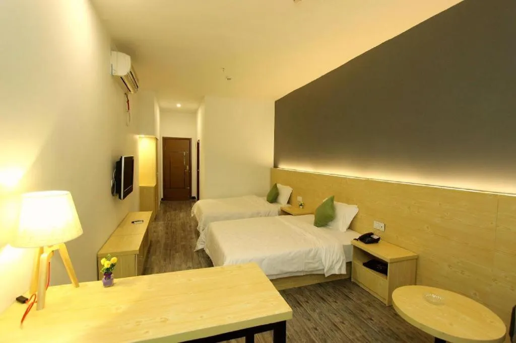 Bed in Yi Mi Hotel Shenzhen Longgang Pinghu South China City