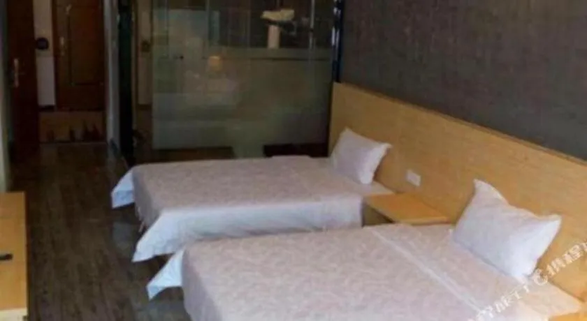 Bed in Yi Mi Hotel Shenzhen Longgang Pinghu South China City