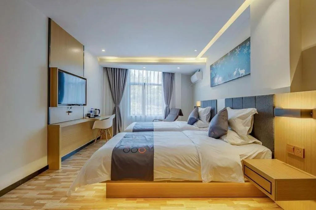 Bed in Yi Mi Hotel Shenzhen Longgang Pinghu South China City
