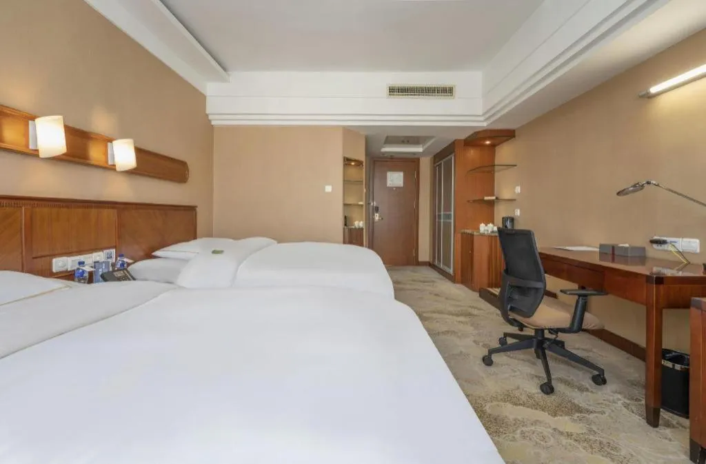 Bed in Yantai Bihai Hotel