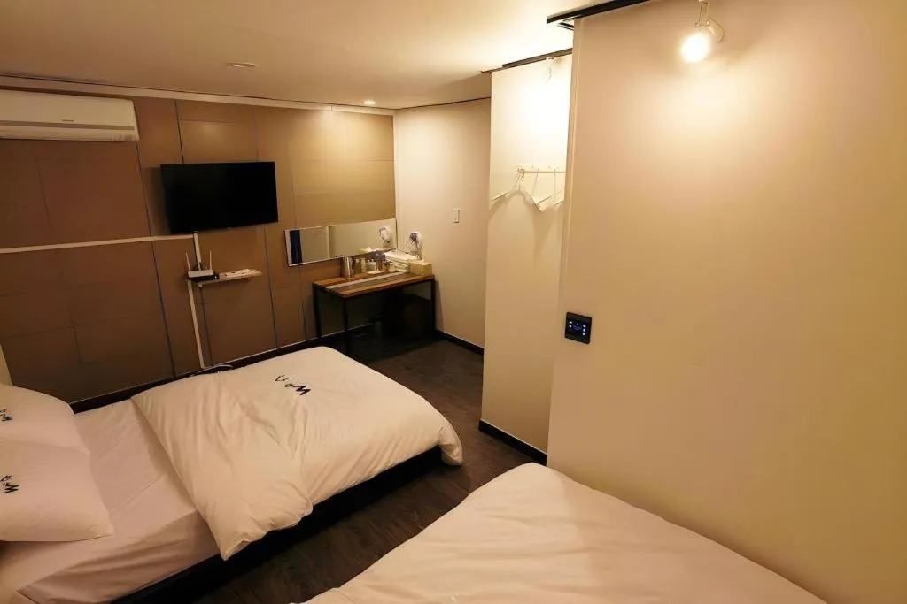 Bed in W Mini Hotel