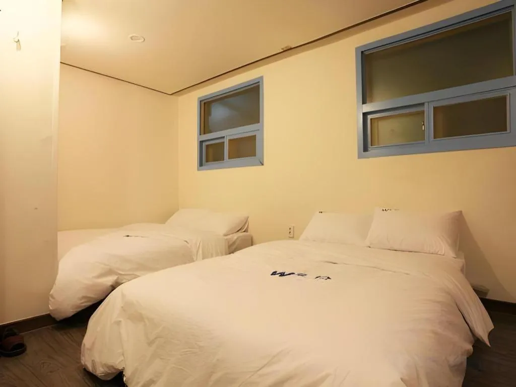 Bed in W Mini Hotel