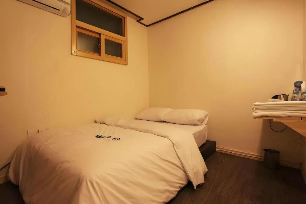 Bed in W Mini Hotel