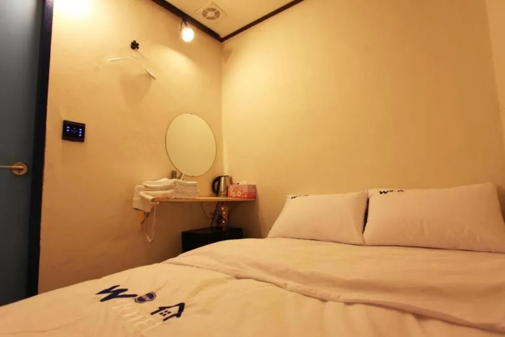 Bed in W Mini Hotel
