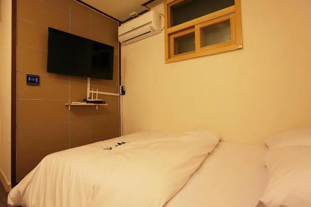 Bed in W Mini Hotel