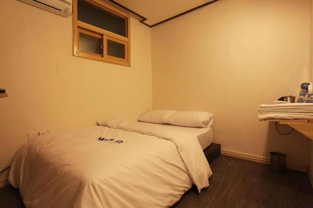 Bed in W Mini Hotel