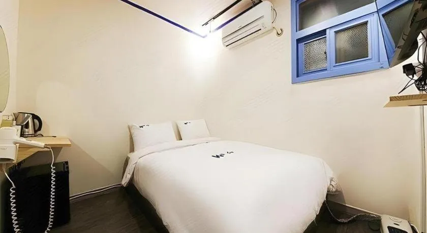 Bed in W Mini Hotel