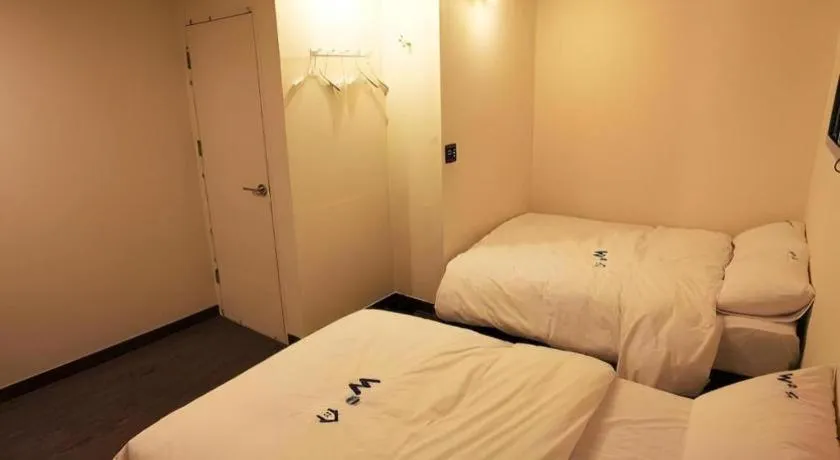 Bed in W Mini Hotel