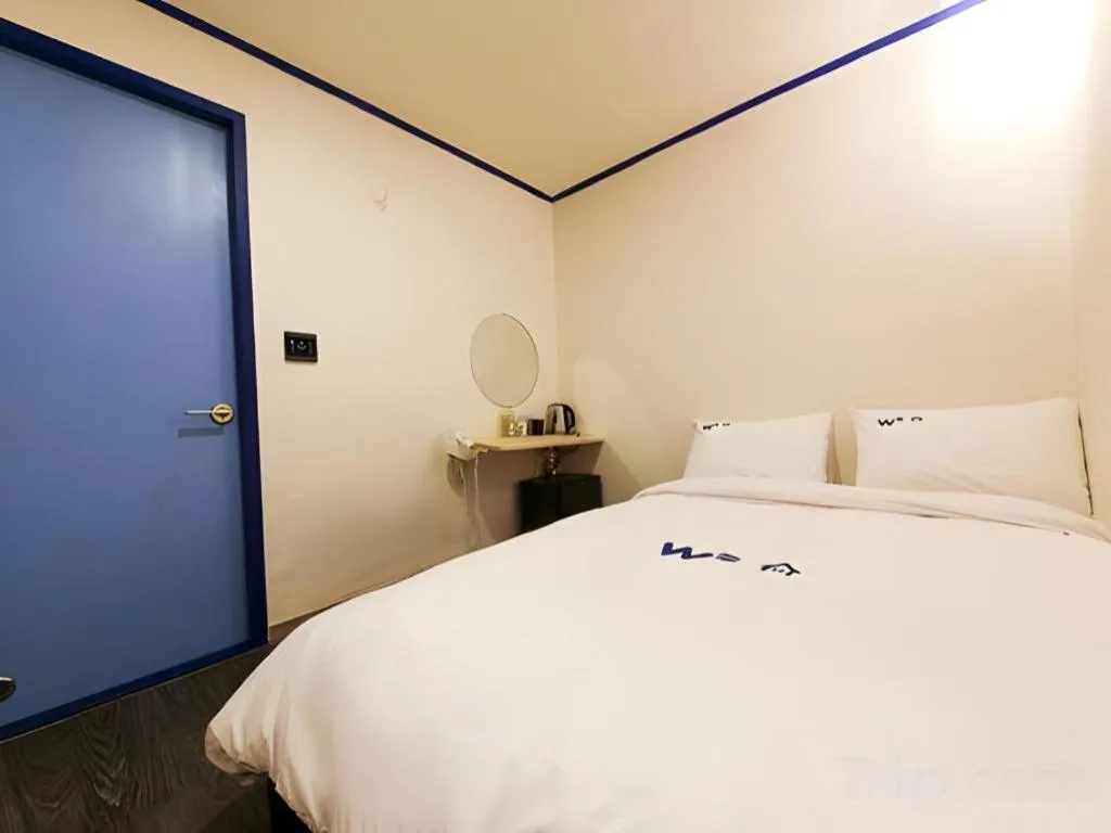 Bed in W Mini Hotel
