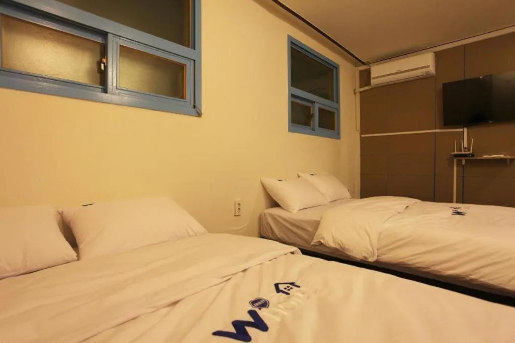 Bed in W Mini Hotel