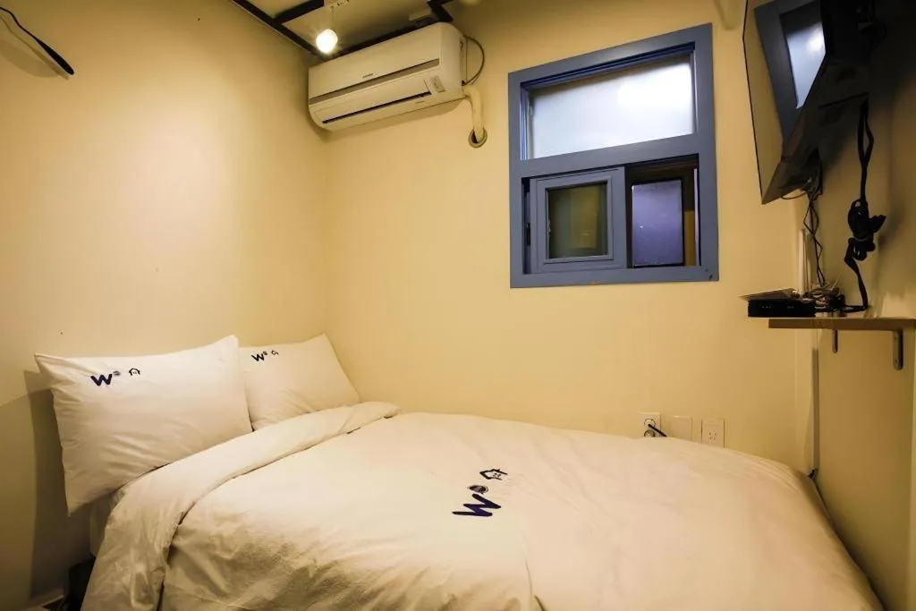 Bed in W Mini Hotel