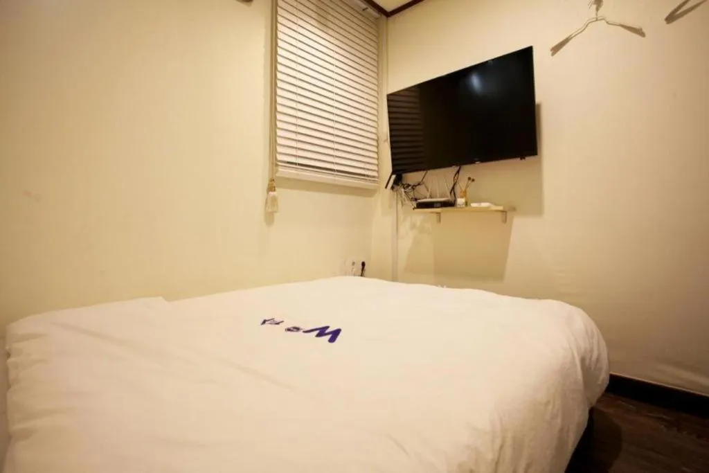 Bed in W Mini Hotel