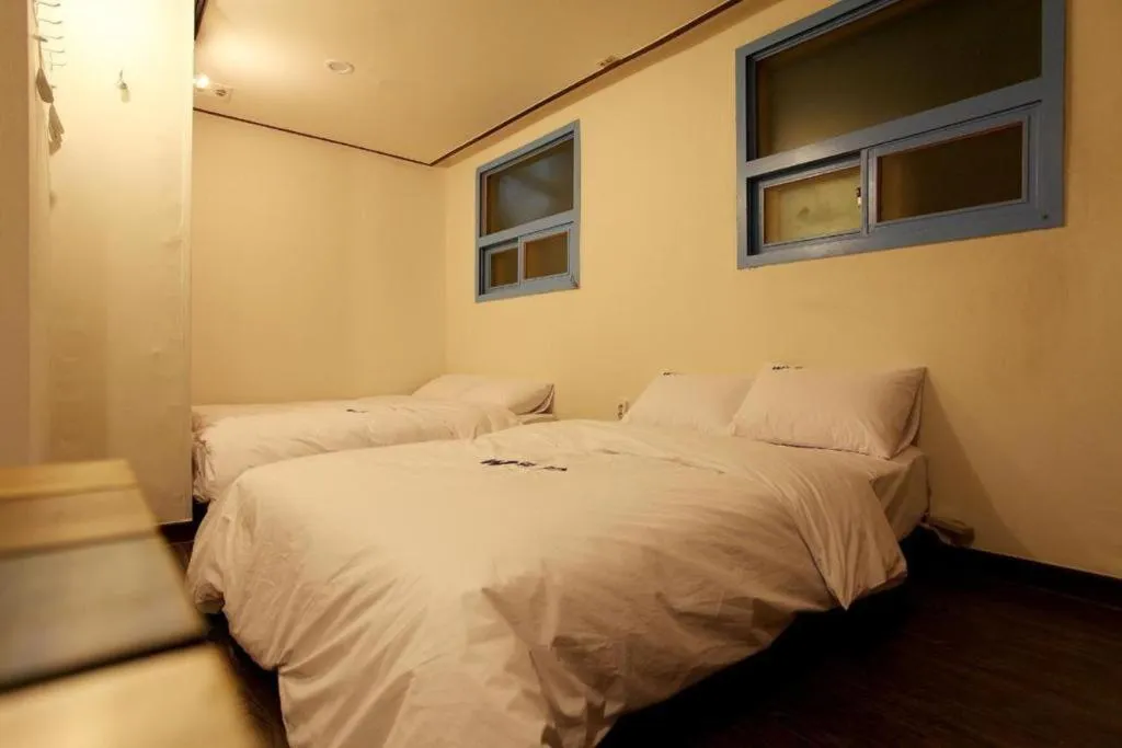 Bed in W Mini Hotel