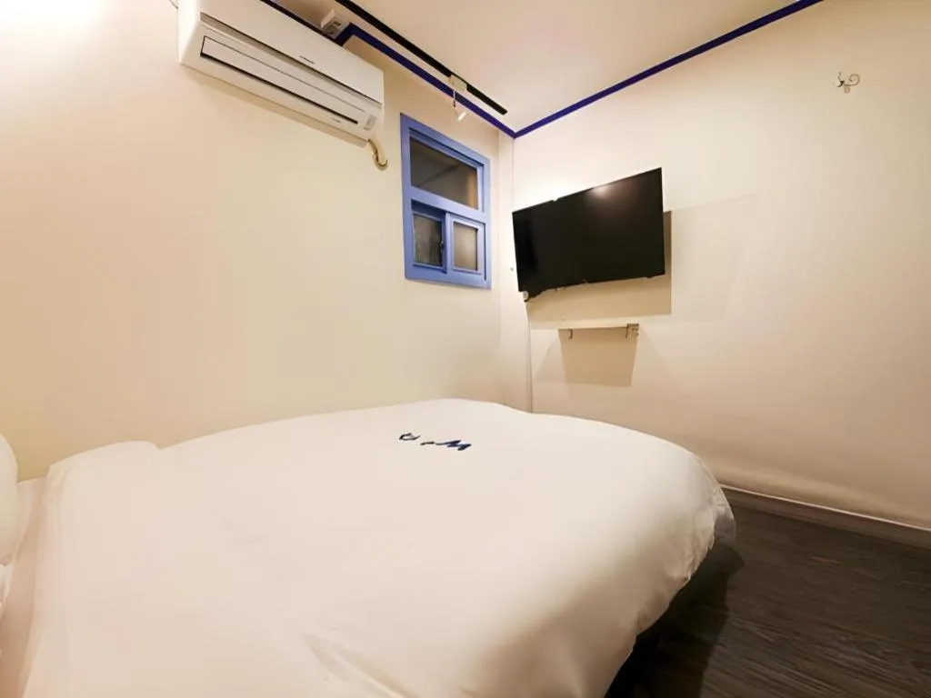 Bed in W Mini Hotel