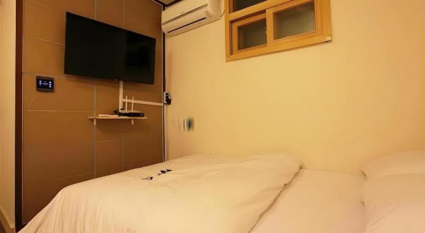 Bed in W Mini Hotel