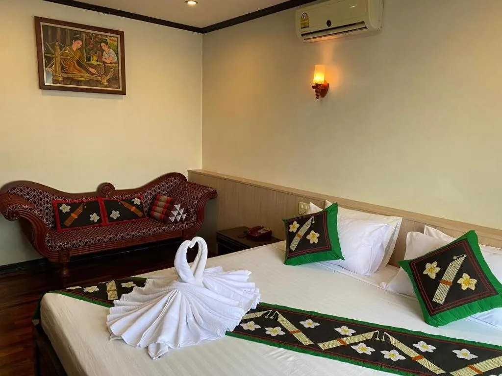 Bed in Anoulack Khen Lao Hotel