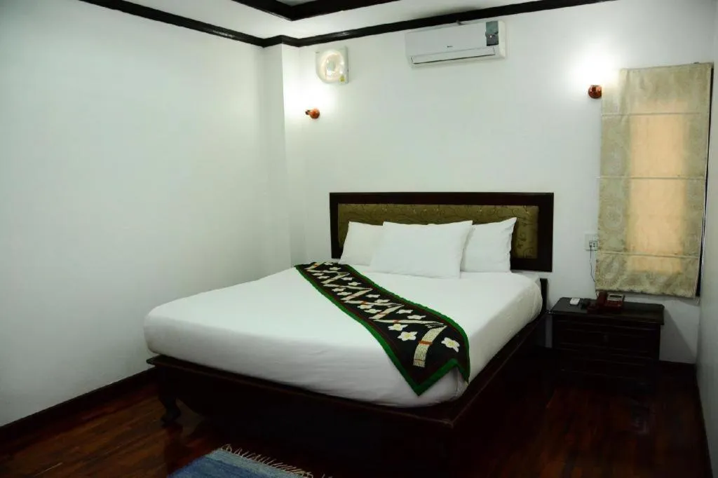 Bed in Anoulack Khen Lao Hotel